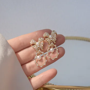 Južná Kórea je nový dizajn a módne šperky sladké a elegantné luk medi zirkón pearl kvapka vody žena visieť náušnice